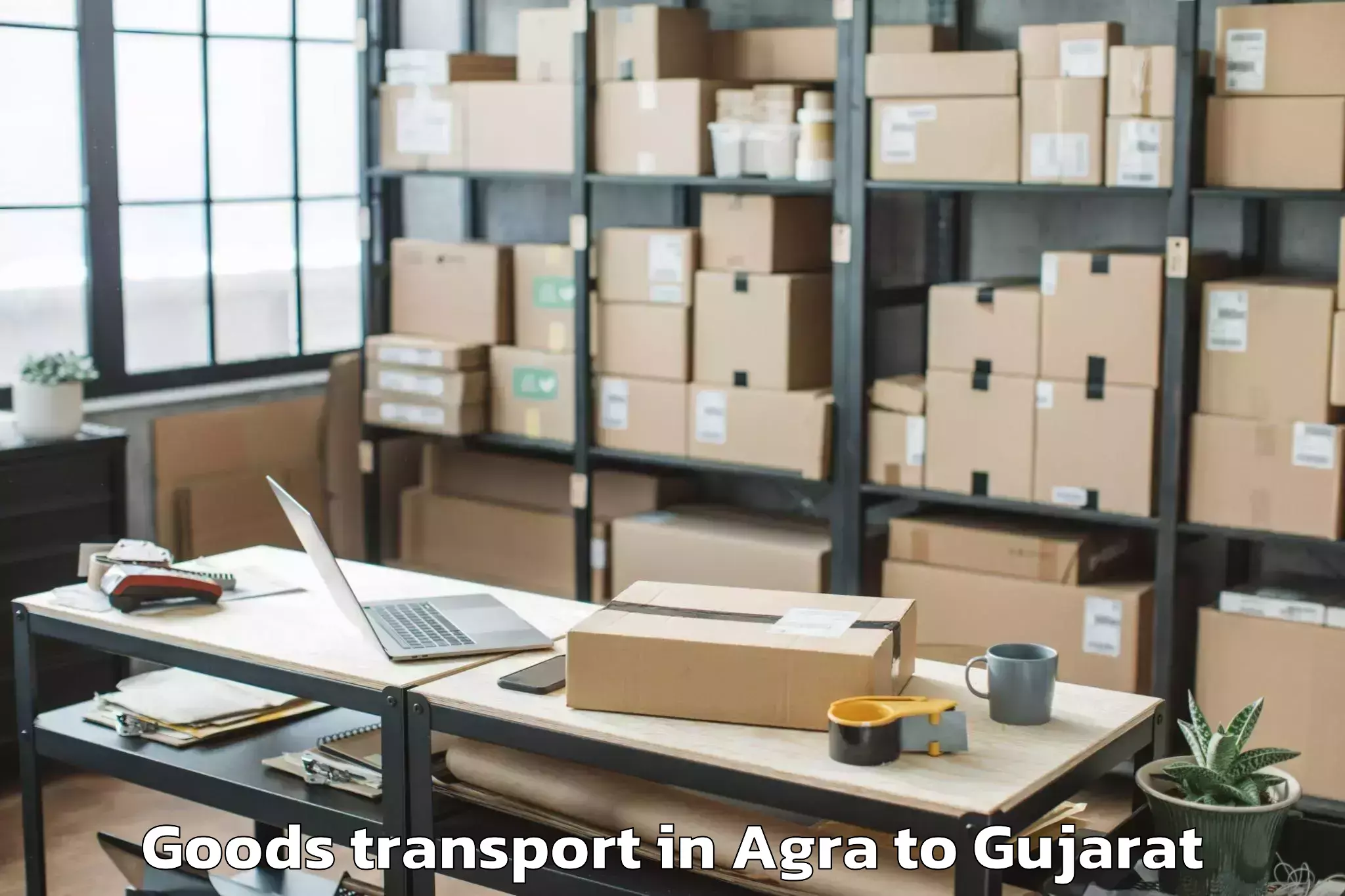 Top Agra to Dhoraji Goods Transport Available